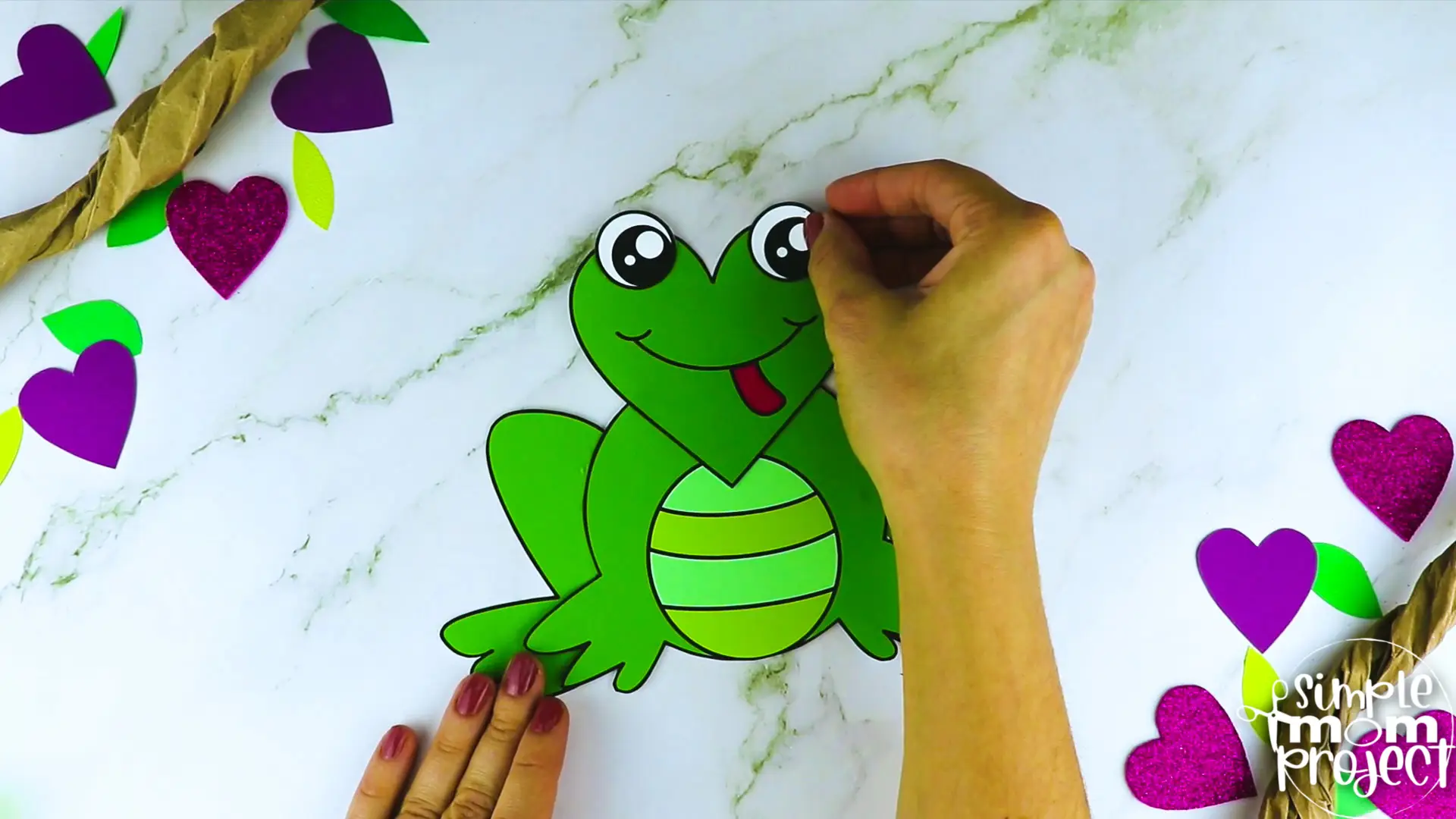Are you looking for a simple heart shaped craft template for your kids? This adorable cut and paste heart frog craft is perfect for you! Your kids will enjoy coloring, cutting and sticking together the printable heart frog patterns. Whether you use this as creative art projects for toddlers, preschoolers or kindergartners or to learn about frogs during homeschooling, this cut and paste heart-shaped frog craft is a great fun for everyone!